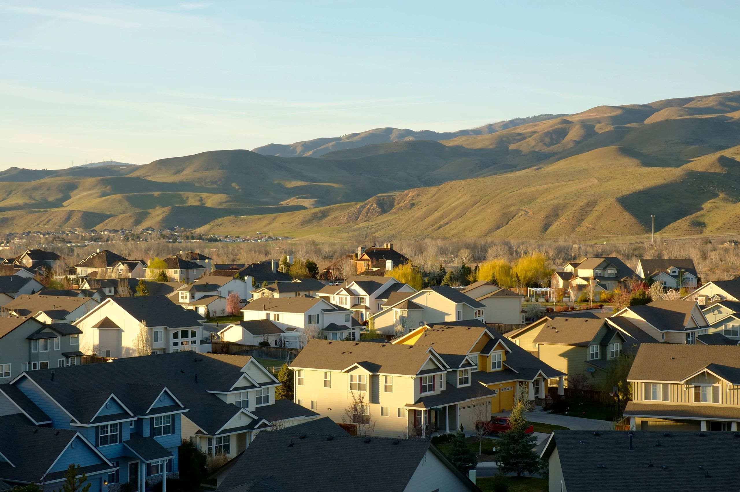 Aerial view of Boise neighborhoods nestled in front of the foothills, representing inherited property sales, estate transitions, and local real estate expertise in Idaho.