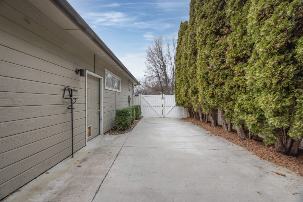 Side yard view featuring RV / boat / toy parking pad at 2680 south loftus way in meridian, idaho listed by jeff sudmeier with idahoreal.estate team at action real estate.